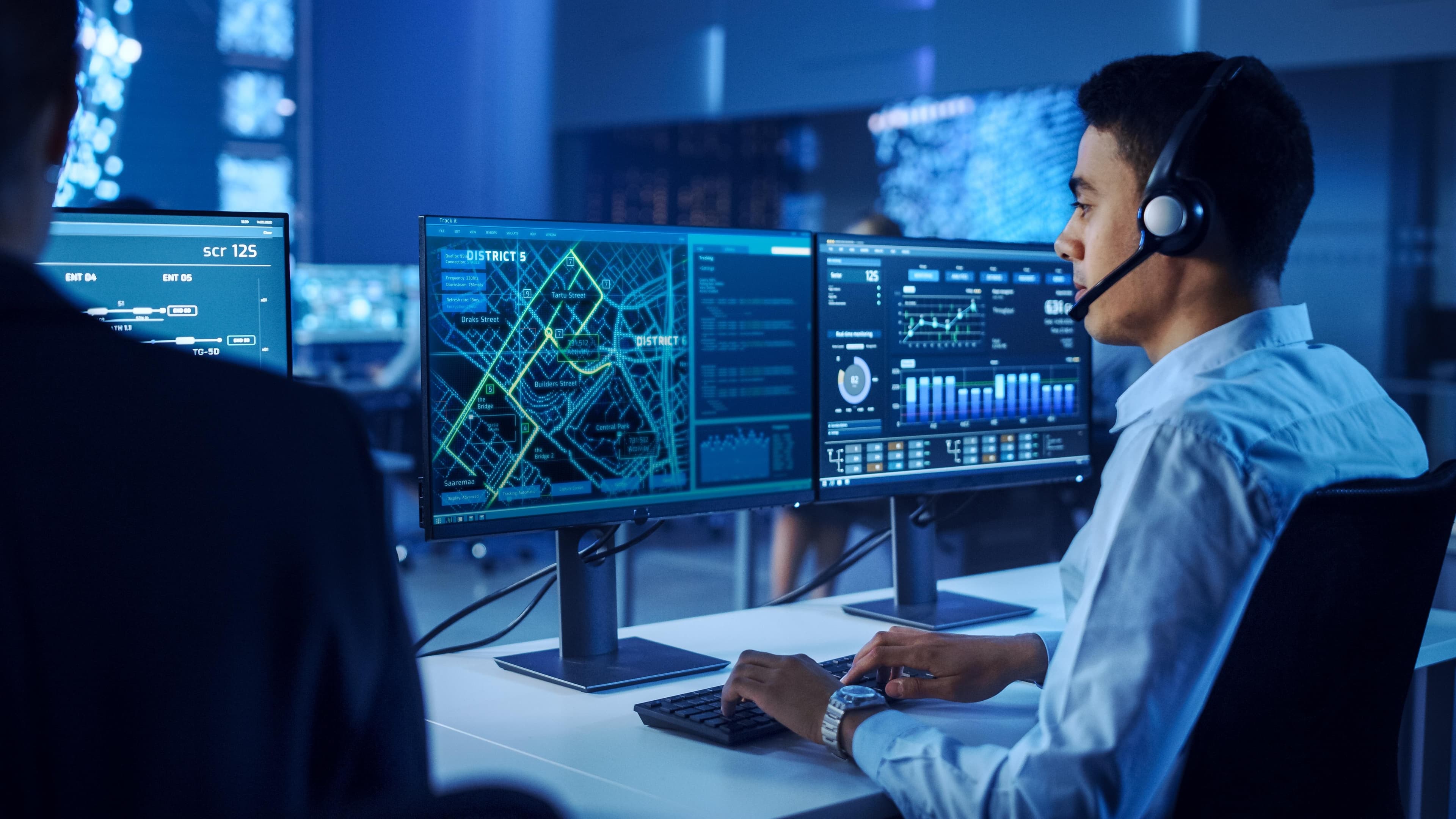 Cybersecurity professional monitoring security dashboards